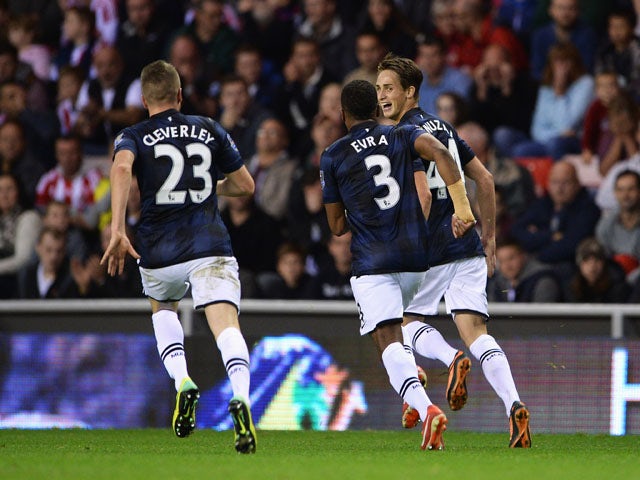 Adnan Januzaj of Manchester United celebrates scoring his team's second goal with Patrice Evra and Tom Cleverley during the Barclays Premier League match between Sunderland and Manchester United at the Stadium of Light on October 5, 2013