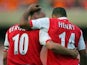 Thierry Henry and Dennis Bergkamp celebrate an Arsenal goal in July 2006.