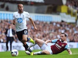 Tottenham Hotspur's English midfielder Andros Townsend runs with the ball past West Ham United's English midfielder Kevin Nolan during the English Premier League football match between Tottenham Hotspur and West Ham United at White Hart Lane in London on 