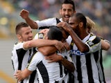 Danilo Larangeira of Udinese celebrates with team-mates after scoring his opening goal during the Serie A match between Udinese Calcio and Cagliari Calcio at Stadio Friuli on October 6, 2013
