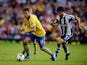 Mesut Ozil of Arsenal is chased by Claudio Yacob of West Bromwich Albion during the Barclays Premier League match between West Bromwich Albion and Arsenal at The Hawthorns on October 6, 2013