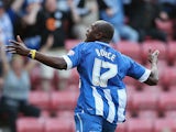Emmerson Boyce celebrates after scoring the winning goal during the Sky Bet Championship match between Wigan Athletic and Blackburn Rovers at DW Stadium on October 6, 2013