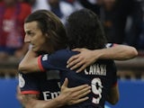 PSG strikers Zlatan Ibrahimovic and Edinson Cavani celebrate a goal by the former against Guingamp on August 31, 2013