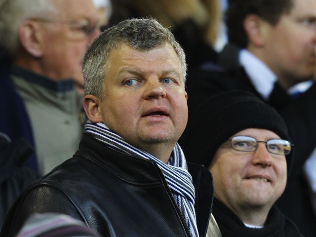 Television presenter Adrian Chiles looks on during the Barclays Premier League match between West Bromwich Albion and Wigan Athletic at The Hawthorns on December 10, 2011