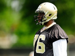 Akiem Hicks #76 of the New Orleans Saints goes through drills during organized team activities at the Saints training facility on May 23, 2013