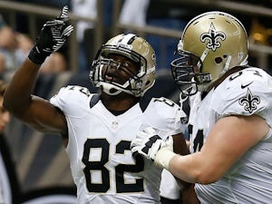 Benjamin Watson #82 of the New Orleans Saints celebrates after scoring a touchdown against the Miami Dolphins at the Mercedes-Benz Superdome on September 30, 2013