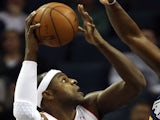 Brendan Haywood of the Charlotte Bobcats tries to shoot over Al Jefferson of the Utah Jazz during their game at Time Warner Cable Arena on January 9, 2013