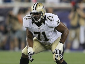 Charles Brown #71 of the New Orleans Saints stands his ground during a preseason game against the New England Patriots in the first half at Gillette Stadium on August 9, 2012