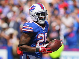 Da'Norris Searcy #25 of the Buffalo Bills returns a fumble 74 yards for a touchdown against the New England Patriots at Ralph Wilson Stadium on September 8, 2013