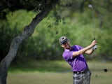 British golfer David Lynn plays a shot from the fairway to the ninth hole during third round of the Portugal Masters golf tournament at Victoria Golf Course in Vilamoura, southern Portugal, on October 12, 2013