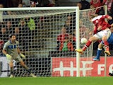 Nicklas Bendtner of Denmark scores his team's first goal past Italy goalkeeper Gianluigi Buffon to equalise during the FIFA 2014 world cup qualifier between Denmark and Italy on October 11, 2013