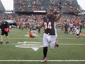 Domata Peko #94 of the Cincinnati Bengals celebrates a victory during the game against the New England Patriots at Paul Brown Stadium on October 6, 2013