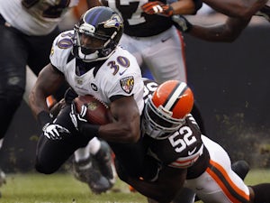 D'Qwell Jackson #52 of the Cleveland Browns tackles Running back Bernard Pierce #30 of the Baltimore Ravens at Cleveland Browns Stadium on November 4, 2012