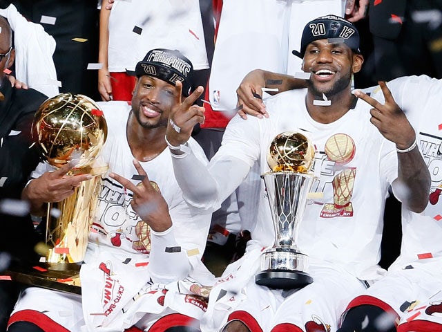 Dwyane Wade and LeBron James of the Miami Heat celebrate after defeating the San Antonio Spurs 95-88 to win Game Seven of the 2013 NBA Finals at AmericanAirlines Arena on June 20, 2013