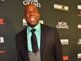 NBA Hall of Fame member and Los Angeles Dodgers part owner Earvin 'Magic' Johnson arrives at the MGM Grand Garden Arena for the Floyd Mayweather Jr. vs. Canelo Alvarez boxing match on September 14, 2013