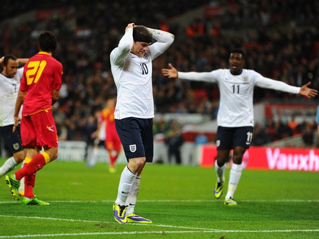 Wayne Rooney of England reacts after missing a chance at goal during the FIFA 2014 World Cup Qualifying Group H match between England and Montenegro at Wembley Stadium on October 11, 2013