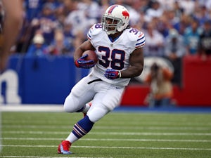Frank Summers #38 of the Buffalo Bills carries the ball during NFL game action against the Carolina Panthers at Ralph Wilson Stadium on September 15, 2013