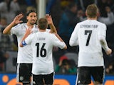 Germany's midfielder Sami Khedira celebrates scoring with Germany's defender Philipp Lahm during the FIFA 2014 World Cup Group C qualifying football match Germany vs Republic of Ireland in Cologne, western Germany on October 11, 2013