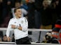 Germany's midfielder Mesut Ozil celebrates scoring his side's 3rd goal during the FIFA 2014 World Cup Group C qualifying football match Germany vs Republic of Ireland in Cologne, western Germany on October 11, 2013