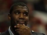 Greg Oden, then of the Portland Trail Blazers, watches from the bench as his teammates take on the Chicago Bulls at the United Center on November 1, 2010