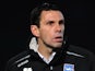 Gus Poyet stands on the touchline during Brighton & Hove Albion vs. Portsmouth in 2011.
