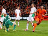 Robin van Persie of Holland celebrates after scoring their fifth goal during the FIFA 2014 World Cup Qualifing match between Holland and Hungary at Amsterdam Arena on October 11, 2013