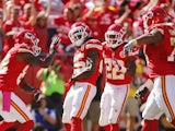 Jamaal Charles of the Kansas City Chiefs celebrates with his team after scoring the first touchdown for the Kansas City Chiefs against the Oakland Raiders on October 13, 2013