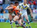 Jason Netherton of Hull KR is stopped by Jon Clarke of Warrington during the Super League Magic Weekend match between Warrington Wolves and Hull KR at Murrayfield Stadium on May 3, 2009 