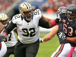 John Jenkins #92 of the New Orleans Saints rushes against Roberto Garza #63 of the Chicago Bears at Soldier Field on October 6, 2013 