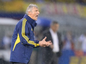 Colombia's coach, Argentine Jose Pekerman, gives instructions to the players during their Brazil 2014 FIFA World Cup South American qualifier match against Ecuador, in Barranquilla, Colombia, on September 6, 2013