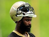 Junior Galette #93 of the New Orleans Saints watches action during organized team activities at the Saints training facility on May 23, 2013
