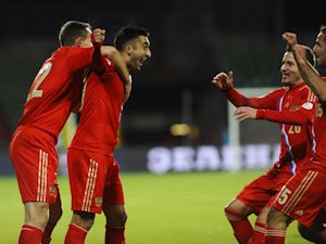 Russia's Alexander Samedov celebrates with teammates after scoring during the FIFA 2014 World Cup Group F qualifying match between Luxembourg and Russia on October 11, 2013