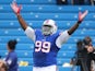 Marcell Dareus #99 of the Buffalo Bills celebrates his sack during an NFL game against the New England Patriots at Ralph Wilson Stadium on September 30, 2012