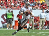 Quarterback Mike Glennon #8 of the Tampa Bay Buccaneers sets to pass against the Arizona Cardinals September 29, 2013