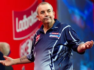 Phil Taylor hits two nine-darters en route to win