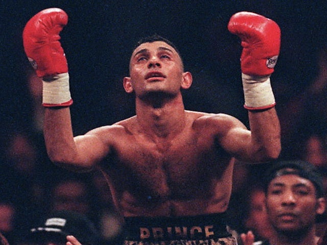 Prince Naseem Hamed, WBO world champion, is lifted high above the crowd after beating Tom Johnson on February 3, 1997