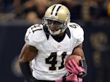 Roman Harper of the New Orleans Saints returns an interception during a 31-24 win over the San Diego Chargers at Mercedes-Benz Superdome on October 7, 2012