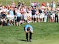 Scott Jamieson of Scotland reacts after narrowly missing a chip shot for birdie and a 59 on the 18th hole during the third round of the Portugal Masters on October 12, 2013