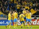 Sweden's players celebrate after the FIFA 2014 World Cup group C qualifying football match Sweden vs Austria on October 11, 2013