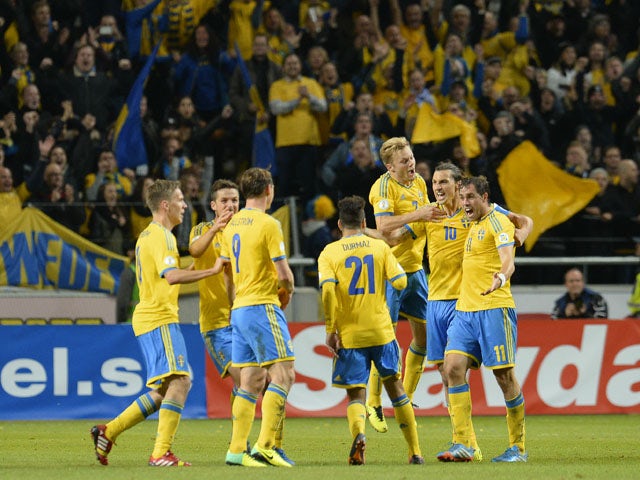 Sweden's players celebrate after the FIFA 2014 World Cup group C qualifying football match Sweden vs Austria on October 11, 2013