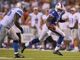 Thad Lewis #9 of the Buffalo Bills runs against the Detroit Lions at Ralph Wilson Stadium on August 29, 2013