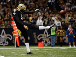 Thomas Morstead #6 of the New Orleans Saints kicks the ball against the Carolina Panthersat the Mercedes-Benz Superdome on December 30, 2012