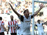 Angel Rangel of Swansea City celebrates his goal during the Barclays Premier League match between Swansea City and Sunderland at Liberty Stadium on October 19, 2013