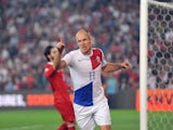 Holland's Arjen Robben celebrates after scoring against Turkey during the 2014 FIFA World Cup qualifying football match on October 15, 2013