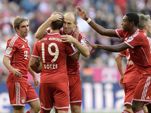 Bayern players celebrate the second goal for Munich during the German first division Bundesliga football match between FC Bayern Munich and FSV Mainz 05 on October 19, 2013