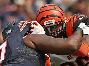 Carolos Dunlap #96 of the Cincinnati Bengals rushes against Jodan Mills #67 of the Chicago Bears at Soldier Field on September 8, 2013 
