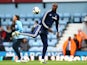 Carlton Cole of West Ham United warms up ahead of the Barclays Premier League match between West Ham United and Manchester City at the Boleyn Ground on October 19, 2013