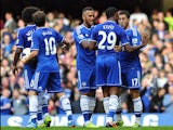 Chelsea's Belgian midfielder Eden Hazard celebrates with teammates after scoring his team's first goal during the English Premier League football match between Chelsea and Cardiff City at Stamford Bridge in west London on October 19, 2013