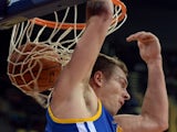 David Lee of the Golden State Warriors scores against the LA Lakers during their NBA Global Game 2013 tour game at the Wukesong Stadium in Beijing on October 15, 2013