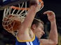 David Lee of the Golden State Warriors scores against the LA Lakers during their NBA Global Game 2013 tour game at the Wukesong Stadium in Beijing on October 15, 2013
